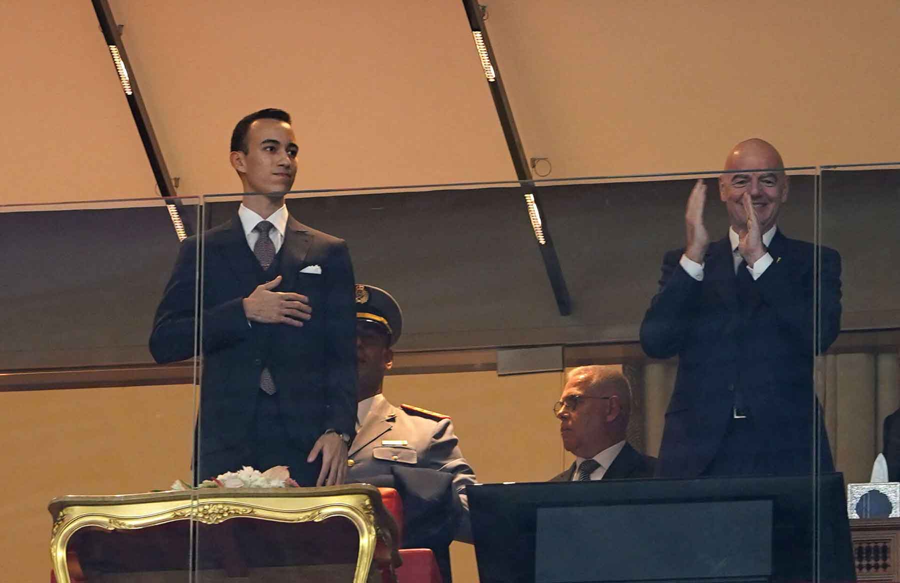 Morocco’s Crown Prince Moulay El Hassan and FIFA President Gianni Infantino in the stands at Prince Moulay Abdellah Stadium in Rabat, December 21, 2025.