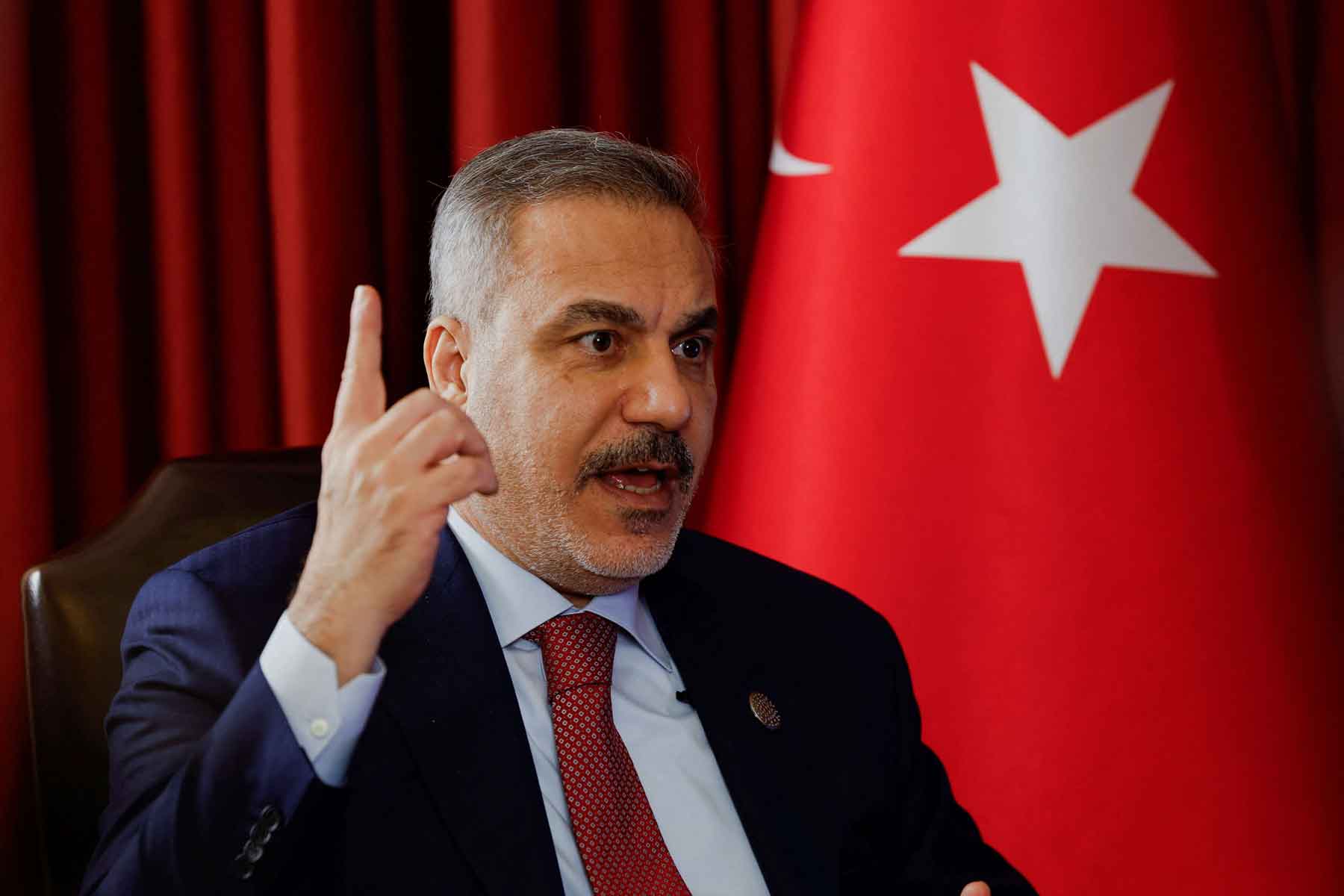 Turkish Foreign Minister Hakan Fidan speaks during an interview at the 23rd edition of the annual Doha Forum, in Doha, December 6, 2025. 