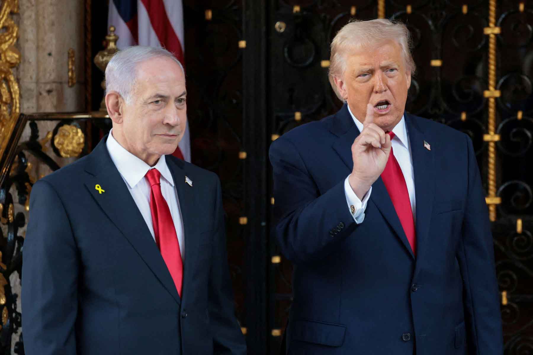 US President Donald Trump speaks to the media next to Israeli Prime Minister Benjamin Netanyahu upon arrival for meetings at Trumps Mar-a-Lago club in Palm Beach, Florida, December 29, 2025. 