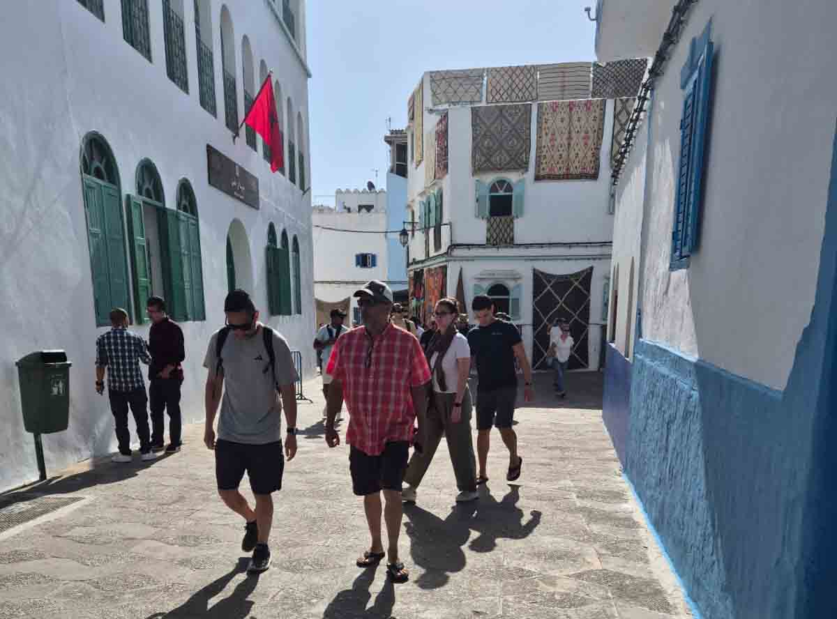 Tourists walking in the medina of the northern city of Assilah