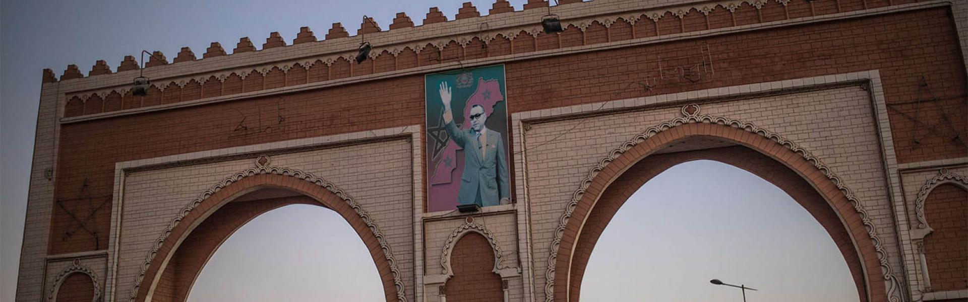 An archway in the entrance of Dakhla carries an image of Morocco's King Mohammed VI