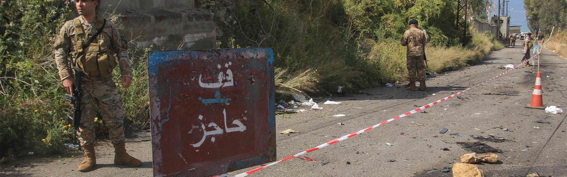 Lebanese security forces set up a checkpoint on the road leading to the scene of an Israeli airstrike in Baawert on April 22