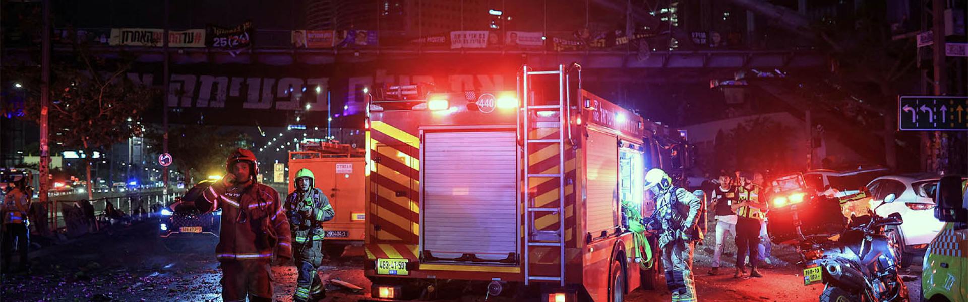 First responders work at an impact site following missile attack from Iran on Israel, in Tel Aviv