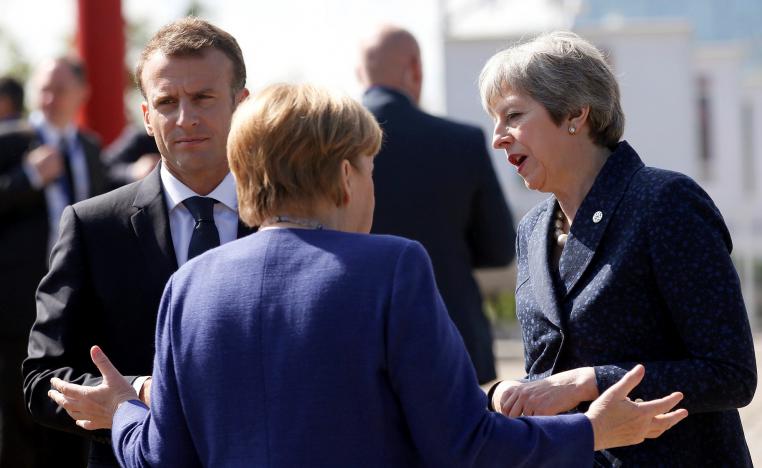 انغيلا ميركل وامانويل ماكرون وتيريزا ماي