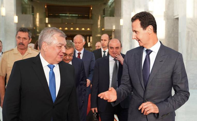 الرئيس السوري بشار الأسد والمبعوث الروسي ألكسندر لافرينتييف 