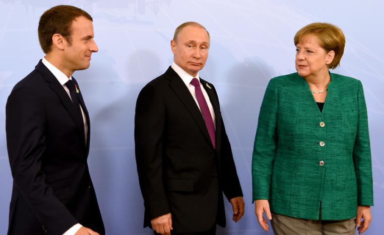 ميركل بوتين وماكرون