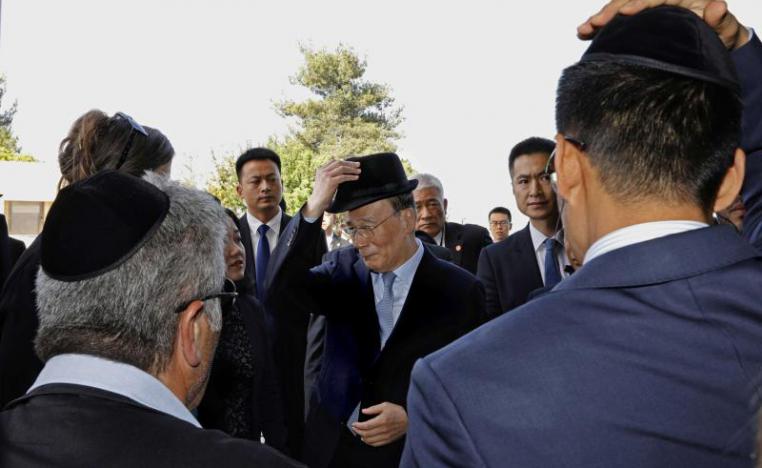Chinese Vice-President Wang Qishan (C) attends a memorial ceremony at the Yad Vashem Holocaust Memorial museum in Jerusalem, on October 24