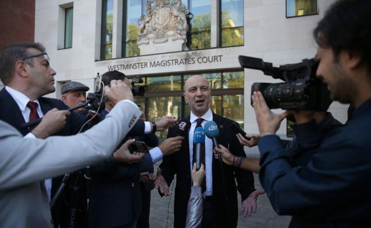 Turkish businessman Akin Ipek speaks to members of the media as he leaves after appearing at Westminster Magistrates Court in London on September 25, 2018.