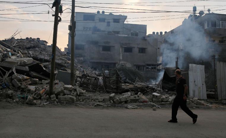 Smoke rises from a residential building that was hit by Israeli airstrikes, in Gaza City, Tuesday, Nov. 13, 2018.