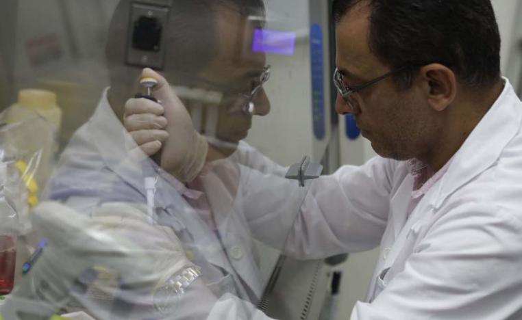 A professor in pharmaceutical sciences performs an in vitro test at a laboratory in the Lebanese American University (LAU) branch near Byblos. 