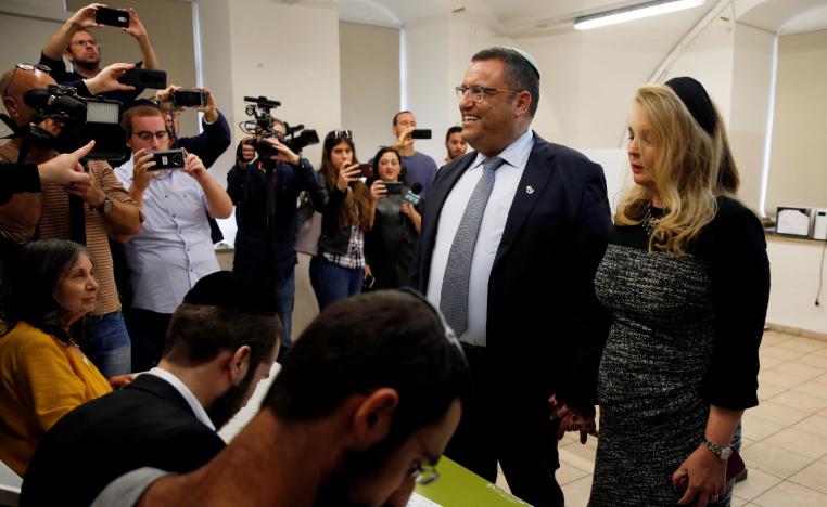 Jerusalem mayoral candidate Moshe Lion and his wife arrive to cast their votes.