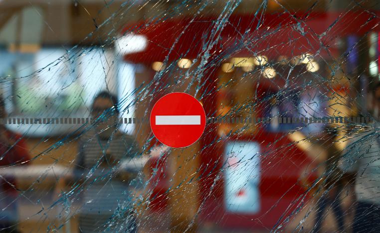 A broken window is seen at Turkey's largest airport, Istanbul Ataturk, Turkey, a day after an attack which killed 45 people, June 29, 2016.