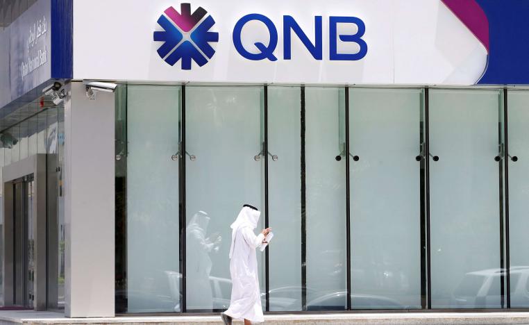 A man walks past a branch of Qatar National Bank (QNB) in Riyadh, Saudi Arabia, June 5, 2017.