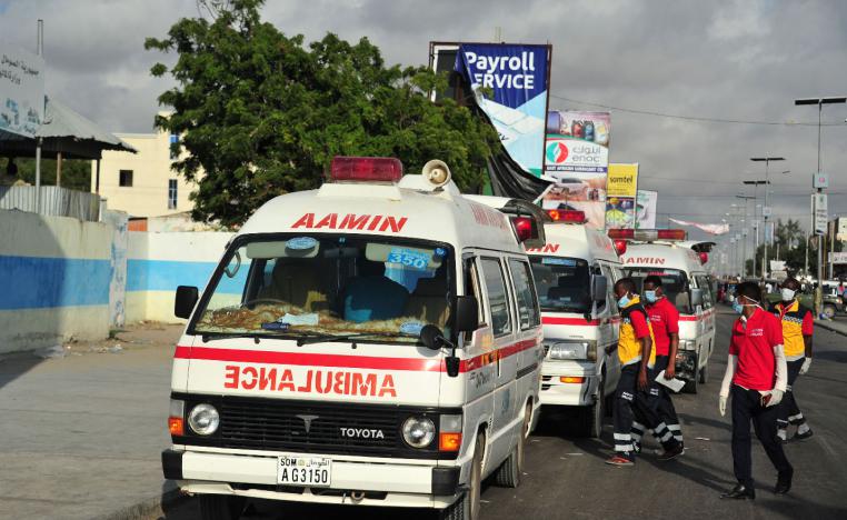 Somali ambulances carrying severely injured patients after an explosion in Mogadishu wait to access the airport where the wounded will be evacuated on Turkish military planes on October 16, 2017.