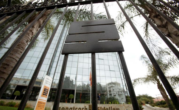 The logo of the state energy company Sonatrach is pictured on a gate outside the headquarters in Algiers