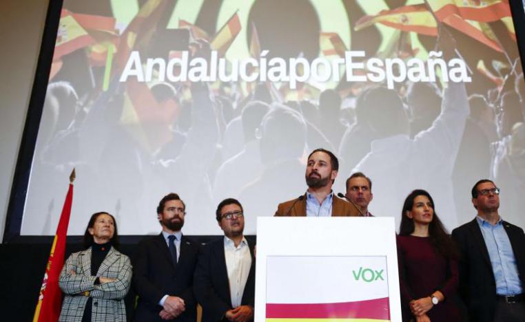 Spain’s far-right Vox party leader Santiago Abascal (C-R) speaks during a news conference in Seville, December 3