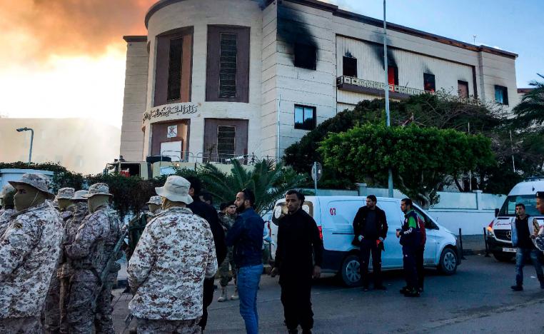 A picture taken on December 25, 2018 shows paramedics and security officers at the scene of an attack outside the Libyan foreign ministry headquarters in the capital Tripoli.