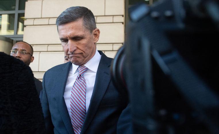 Former US national security adviser Michael Flynn passes by members of the media at US District Court in Washington, on December 18. 