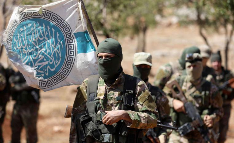 Syrian fighters attend a mock battle in anticipation of an attack by the regime on Idlib province and the surrounding countryside, during a graduation of new Hayat Tahrir al-Sham (HTS) members at a camp in the countryside of the northern Idlib province on August 14, 2018.