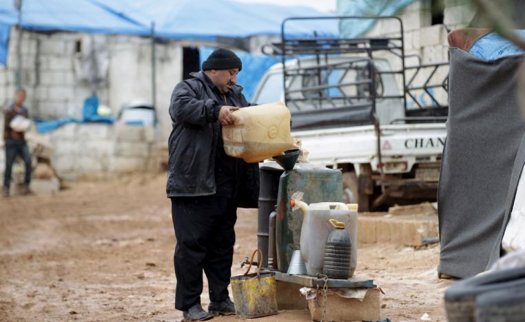 A man fills up fuel near the Turkish border in Idlib province, Syria.