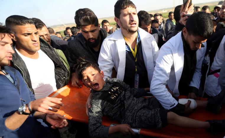 A wounded Palestinian boy reacts as he is evacuated during a protest at the Israel-Gaza fence, in the southern Gaza Strip January 25, 2019. 