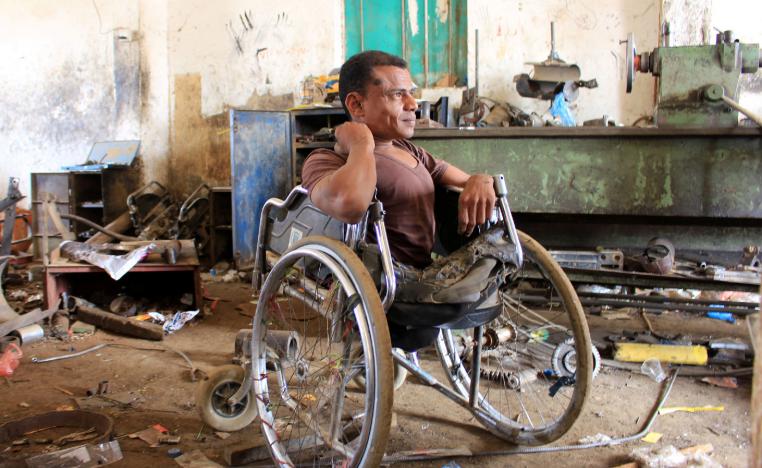 Yaarub Eissa sits in his wheelchair at a blacksmith workshop where he works in Abs, in the northern province of Hajjah, Yemen January 19, 2019.