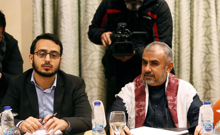 Hadi Haig (R), the head of the Yemeni Government delegation, attends a meeting to discuss prisoner swap deal 