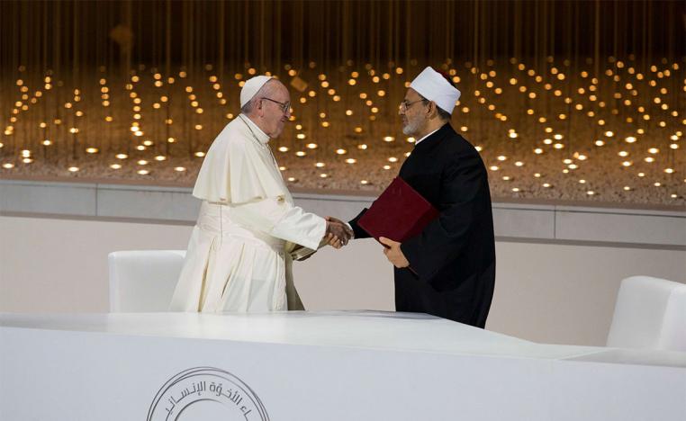 ope Francis (L) shakes hands with Ahmed Al-Tayeb, Grand Imam of Al Azhar, after signing the Human Fraternity Document