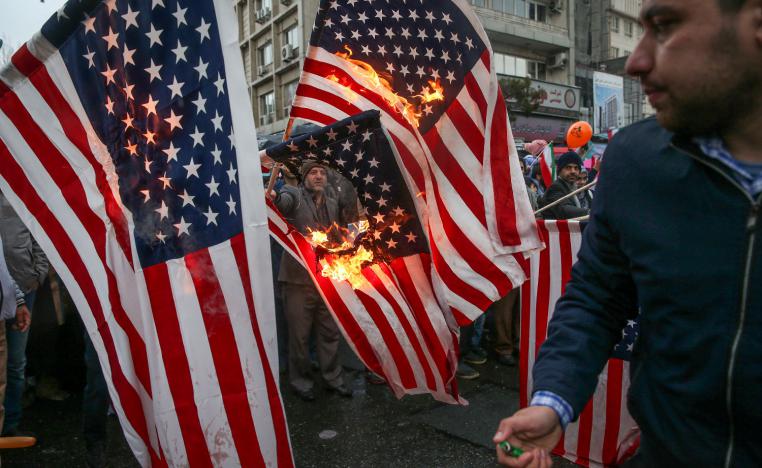 Iranians burn U.S. flags during a ceremony to mark the 40th anniversary of the Islamic Revolution in Tehran, Iran February 11, 2019. 