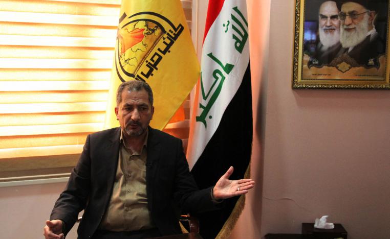 Iraq's spokesman for the Hezbollah Brigades Mohammed Mohie gestures during a news conference in Baghdad on February 5, 2019.