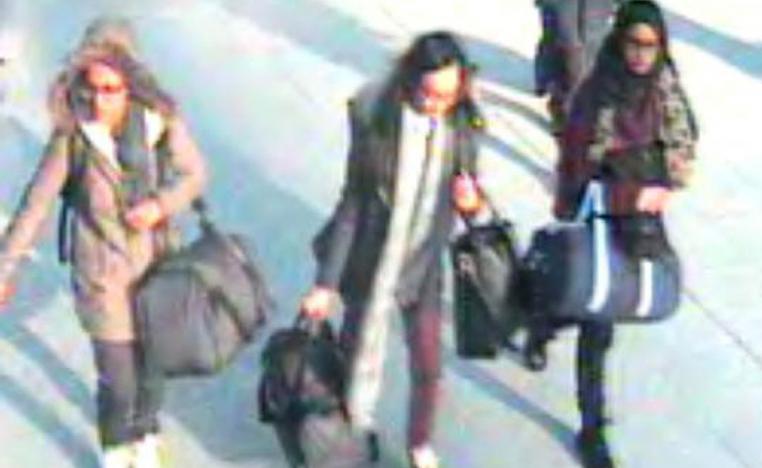 In this file handout photo taken on February 17, 2015 a video grab taken from CCTV, received from the Metropolitan Police Service (MPS) on February 23, 2015, shows (L-R) British teenagers Amira Abase, Kadiza Sultana and Shamima Begum at Gatwick Airport, south of London.