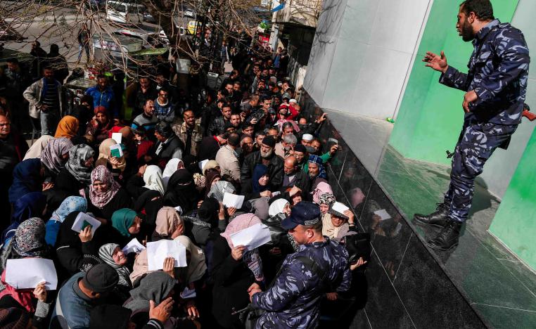 Thousands of Palestinians could be seen queueing early at post offices across Gaza