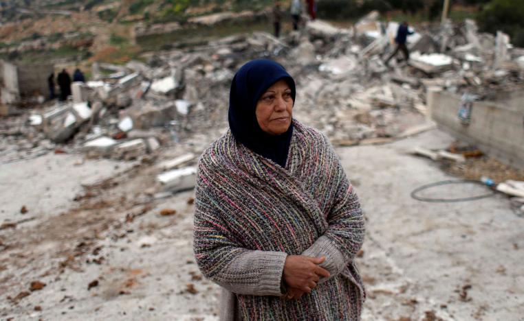 The mother of Palestinian assailant Asem Al-Barghouti looks on as she stands near the remains of his house after it was demolished by Israeli forces, in the village of Kobar near Ramallah, in the Israeli-occupied West Bank, March 7, 2019.