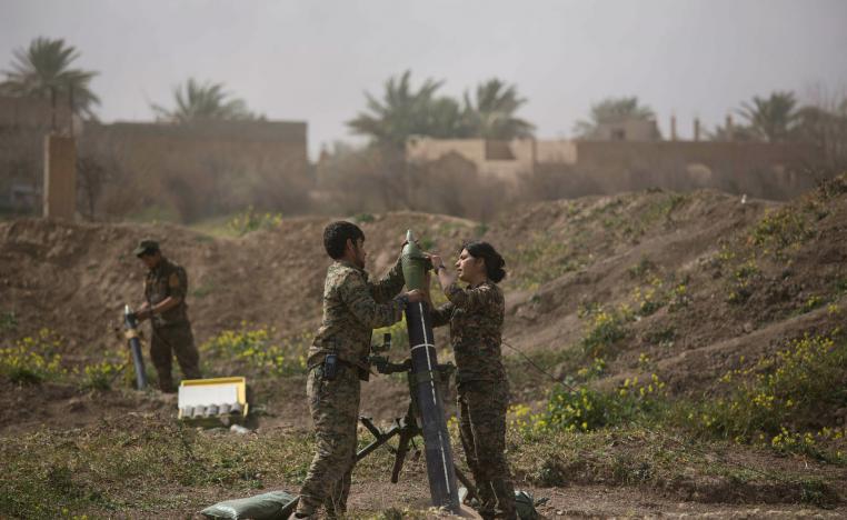 U.S.-backed Syrian Democratic Forces (SDF) soldiers prepare to fire mortars at Islamic State militant positions in Baghouz, Syria, Wednesday, March 13, 2019.