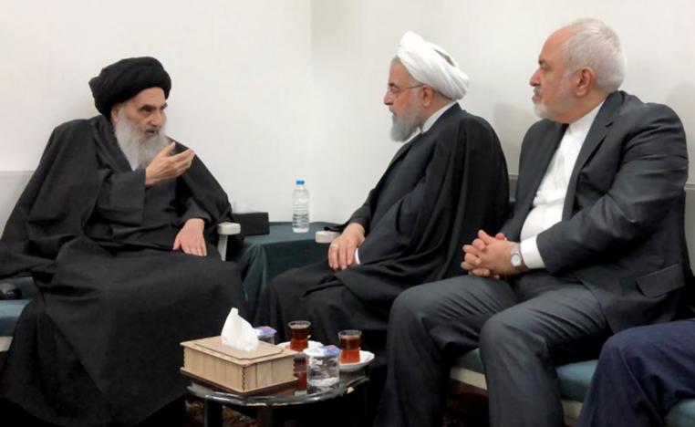 A handout picture provided by the media office of Grand Ayatollah Ali Sistani shows the chief Shiite cleric (L) meeting with Iranian President Hassan Rouhani (C) and Foreign Minister Mohammad Javad Zarif (R) in the Iraqi central city of Najaf on March 13, 2019.