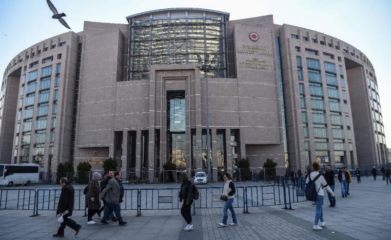 People walk by Istanbul's courthouse on March 26, 2019, during the trial of a US consulate staffer accused of spying and attempting to overthrow the government.