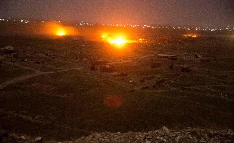 Islamic State militant positions are ablaze in Baghouz, Syria.