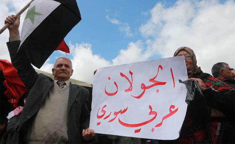 Protesters in Quneitra in Syrian Golan Heights protest against US' decision to recognise Israel's sovereignty over occupied territory 
