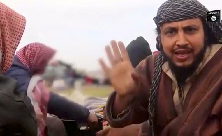 A man said to be an Islamic State militant, Abu Abd Al-Azeem, speaks in Baghouz, Syria in this still image taken from a video obtained by Reuters March 12, 2019.