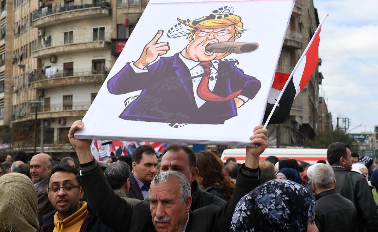 Syrians protest in the northern city of Aleppo against the US' decision to recognise Israel's sovereignty over the Golan Heights on March 26, 2019.