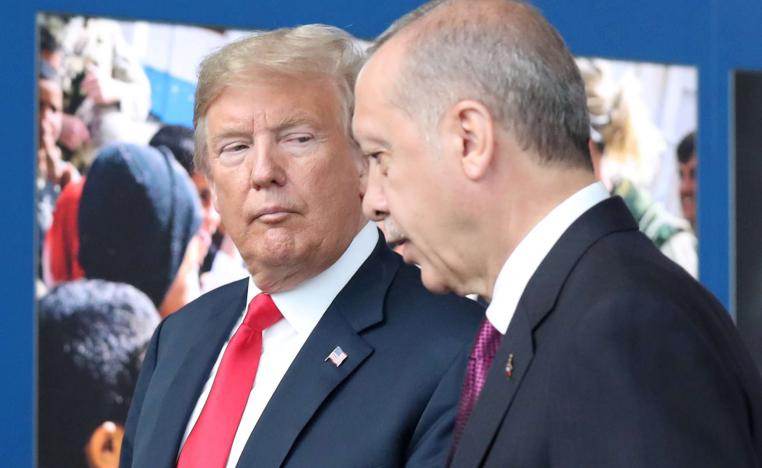 US President Donald Trump (L) talks to Turkey’s President Recep Tayyip Erdogan (R) at NATO headquarters in Brussels, Belgium, 11 July 2018.