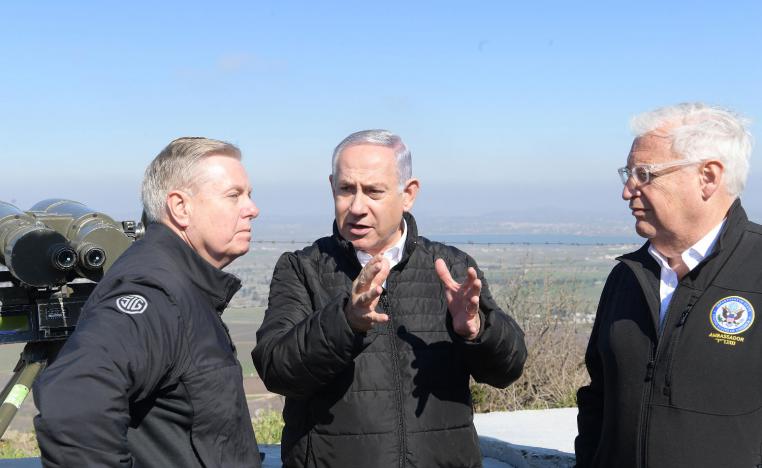 Israeli Prime Minister Benjamin Netanyahu (C), US Ambassador in Israel David Friedman (R) and US Senator Lindsey Graham visit the Golan Heights.