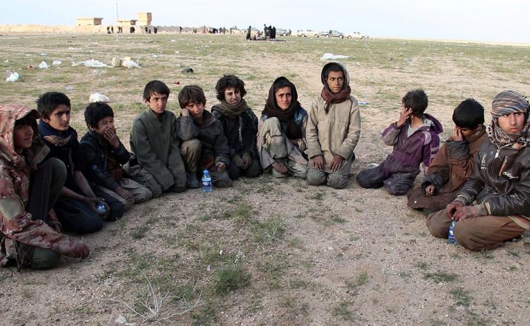 Saddam, (R) a 15 year old Yazidi boy and ten other Yazidi children gather in a area held by the US-backed Kurdish-led Syrian Democratic Forces (SDF), in the eastern Syrian province of Deir Ezzor, after fleeing the Islamic State (IS) group's embattled holdout of Baghouz, on February 23, 2019.Saddam, (R) a 15 year old Yezidi boy and ten other Yezidi children gather in a area held by the US-backed Kurdish-led Syrian Democratic Forces (SDF), in the eastern Syrian province of Deir Ezzor, after fleeing the Islami