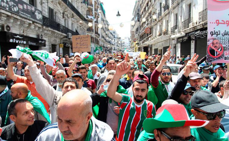 Algerians gather during an anti government demonstration in the capital Algiers 