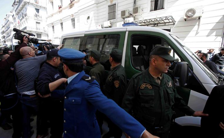 The former central bank governor is the first government official to appear before prosecutors since mass protests