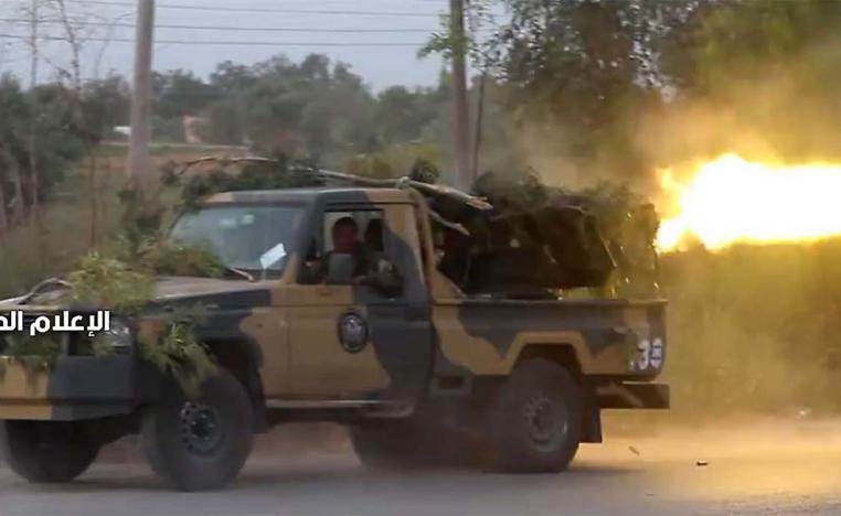 Videos of battles showed militia fighters on global lists of wanted terrorists and human traffickers
