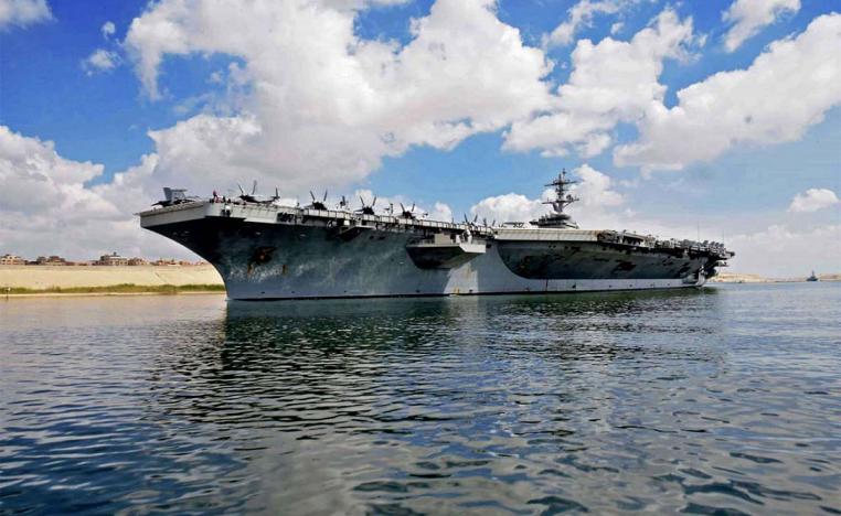 USS Abraham Lincoln on its way to to unspecified waters in the vicinity of Iran 