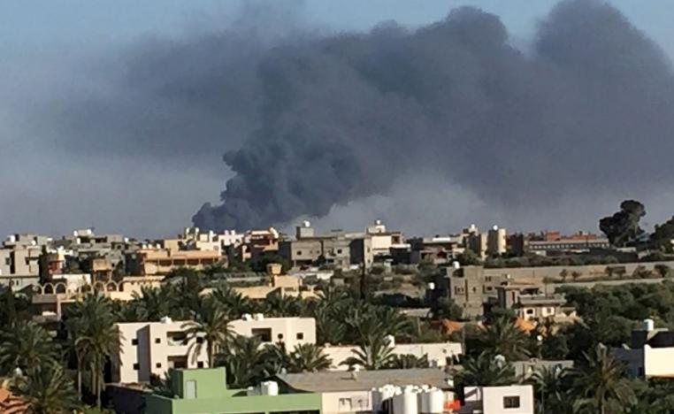 Smoke rises during fighting in Ain Zara, Tripoli