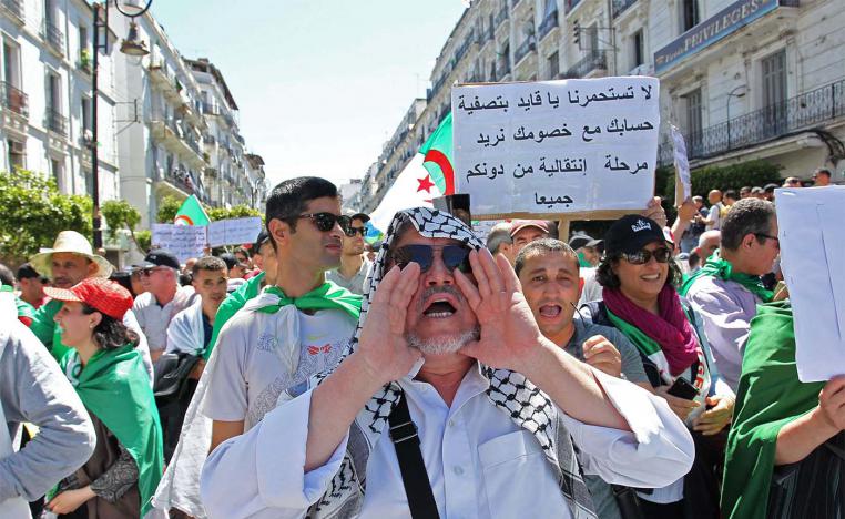 Algerian protesters chant slogans as they take part in an anti-government demonstration in Algiers 