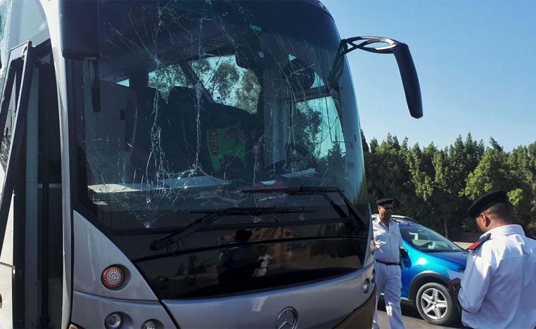 Tourist bus damaged during a bomb blast near Giza pyramids.